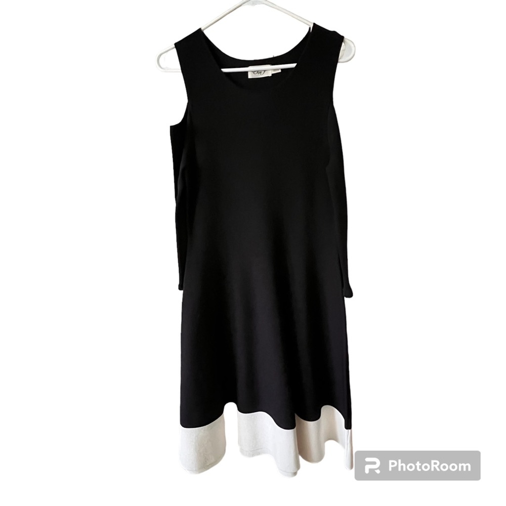 Black and cream women’s size large dress w/ cut out shoulders, great condition!